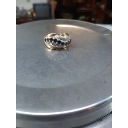 Gold ring with 9 blue...
