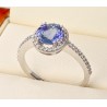 Gold ring with central tanzanite stone and diamonds